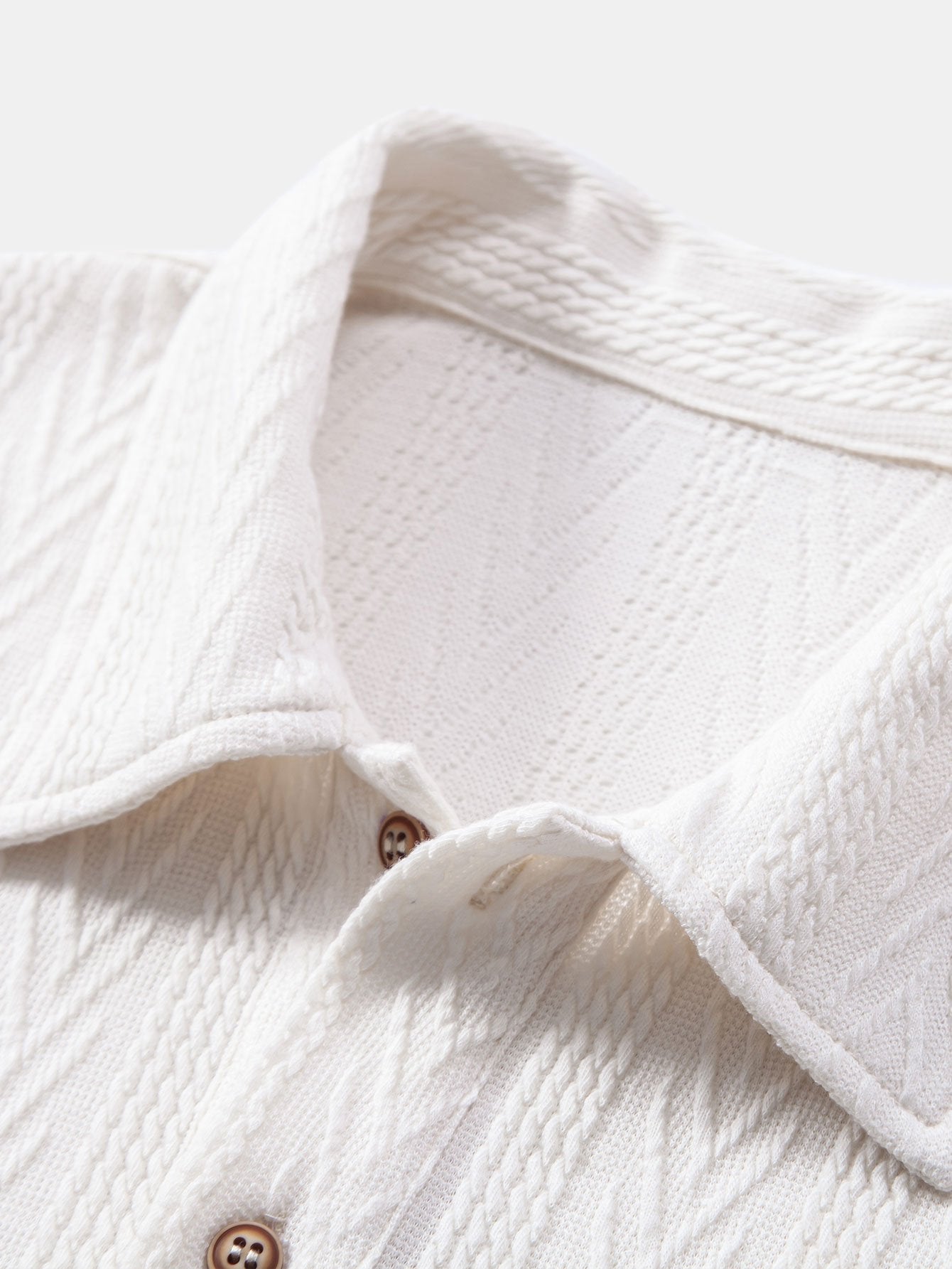 POLO IN JACQUARD GEOMETRICO LAVORATO A MAGLIA