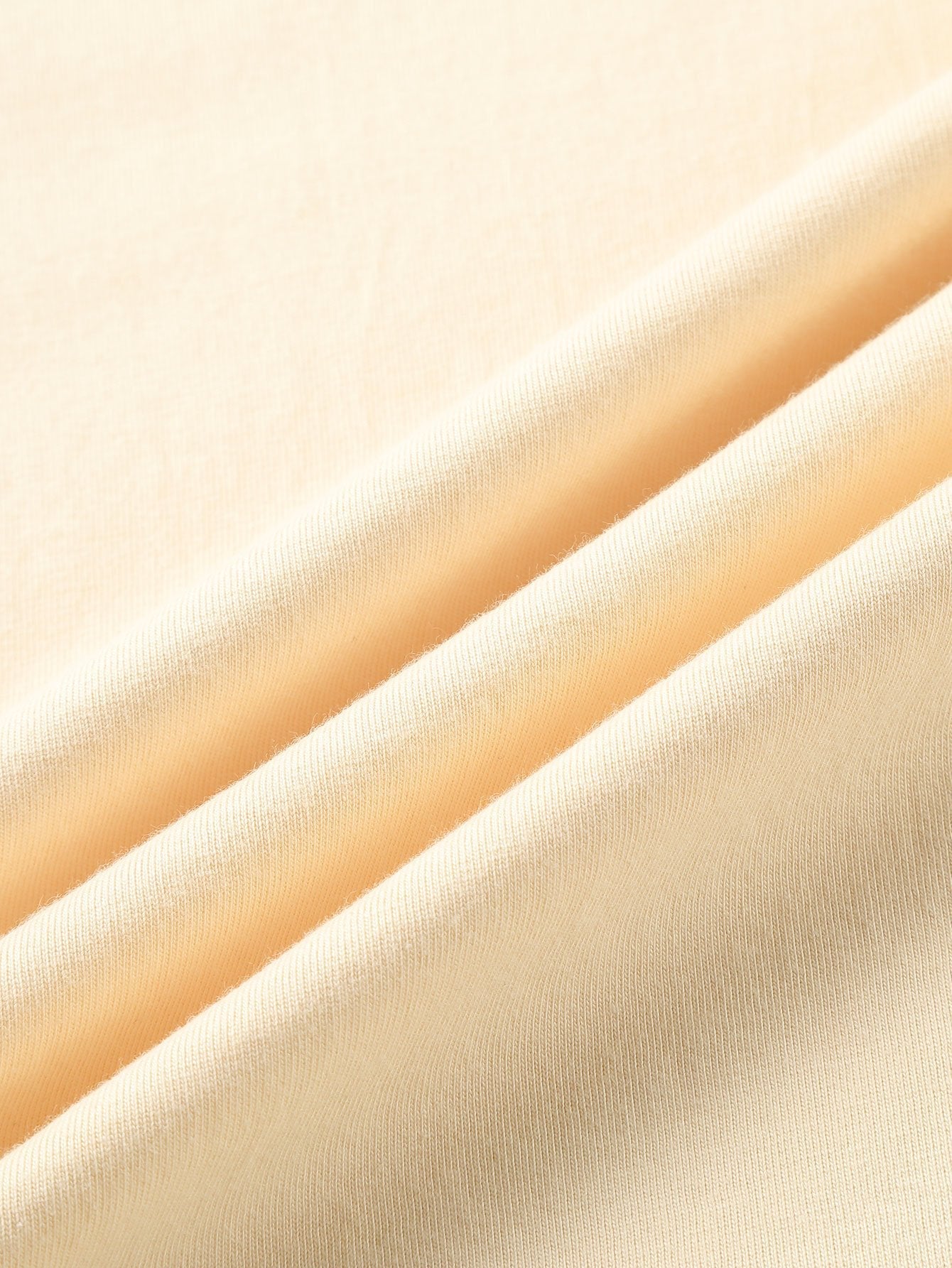 T-SHIRT A MANICHE LUNGHE PESANTE CON ORLO CURVO