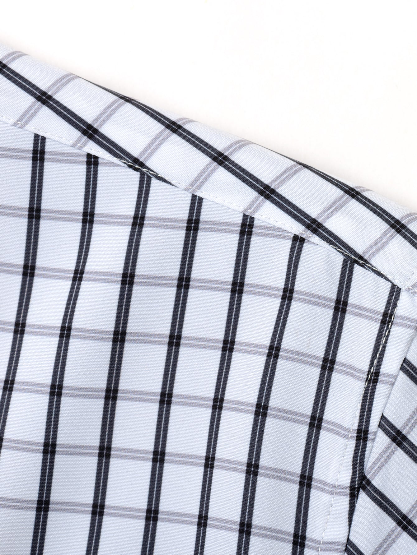 CAMICIA A MANICHE LUNGHE A QUADRETTI CON BOTTONI