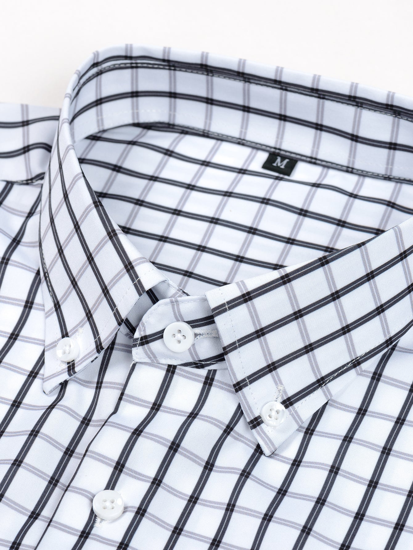 CAMICIA A MANICHE LUNGHE A QUADRETTI CON BOTTONI